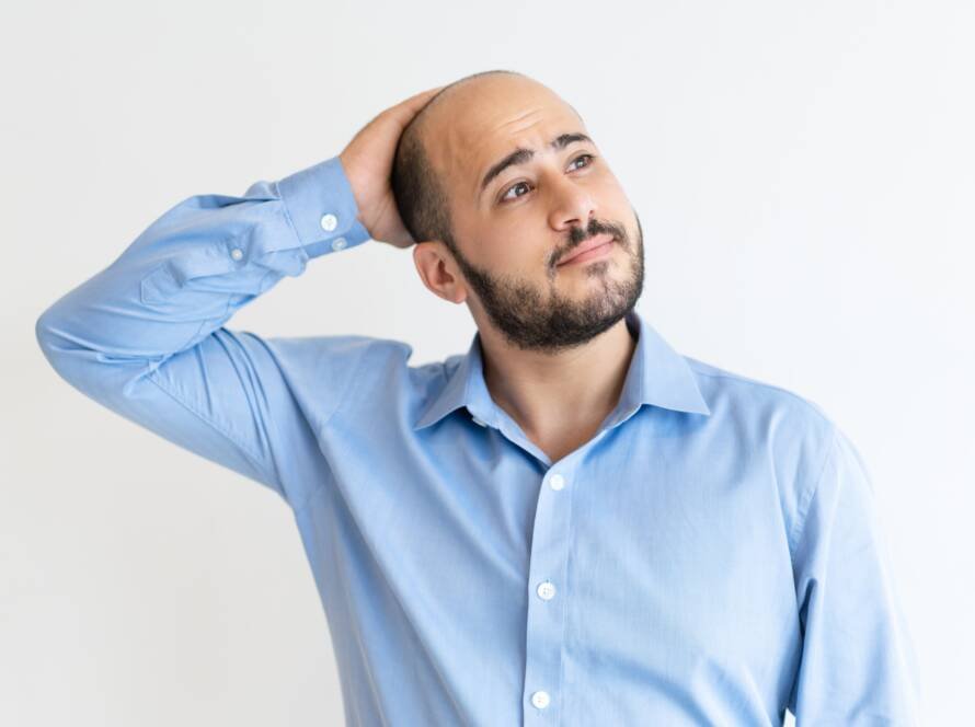 Man wearing loose cotton cap after hair transplant recovery at CFH Skin and Hair Clinic Chennai